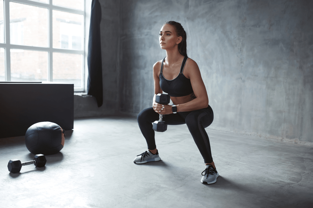 Goblet squats with resistance band